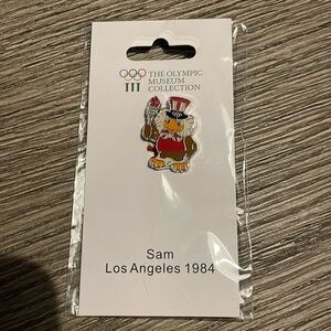 The Heritage Collection USA Olympic Sam Mascot pin badge.